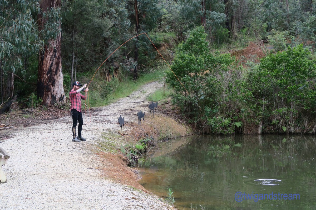 Man catching a fish fly fishing