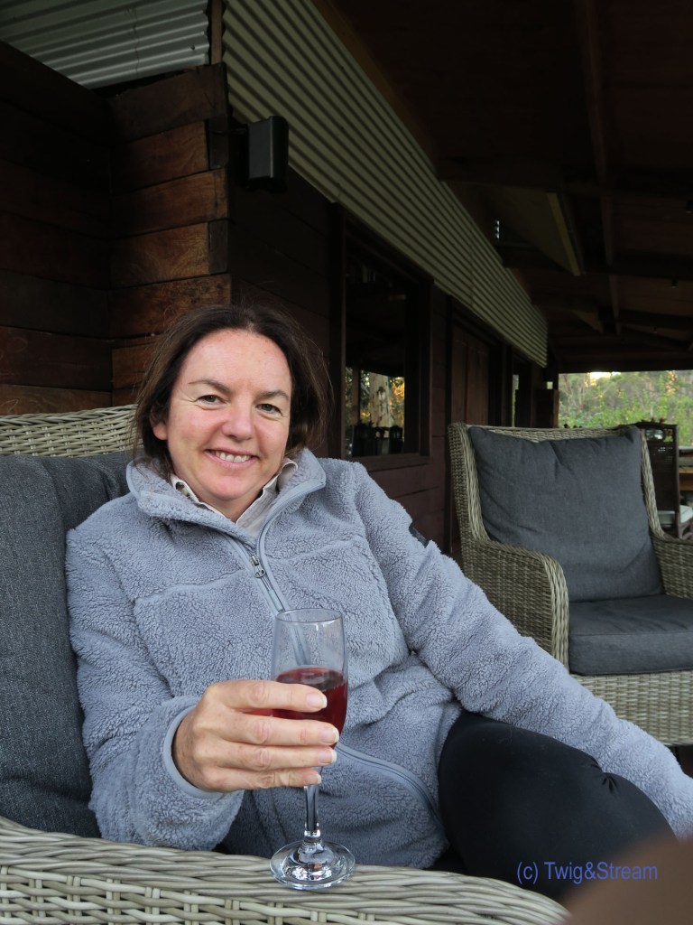 Enjoying a glass of bubbles after fly fishing.