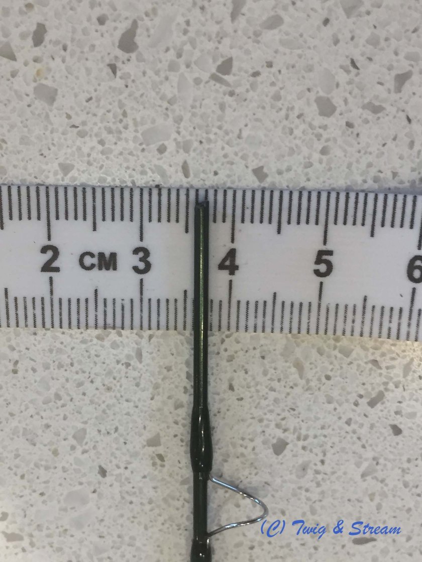 Photo of broken tip on tape measure, zoomed in